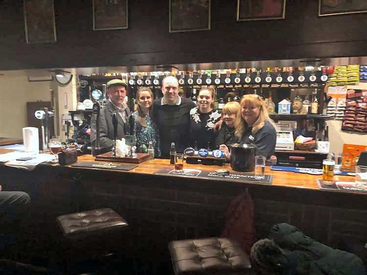 Margarat Moran at bar with family