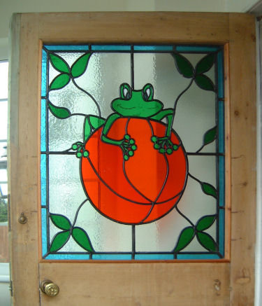 Frog and Orange window at Shatterling, Staple